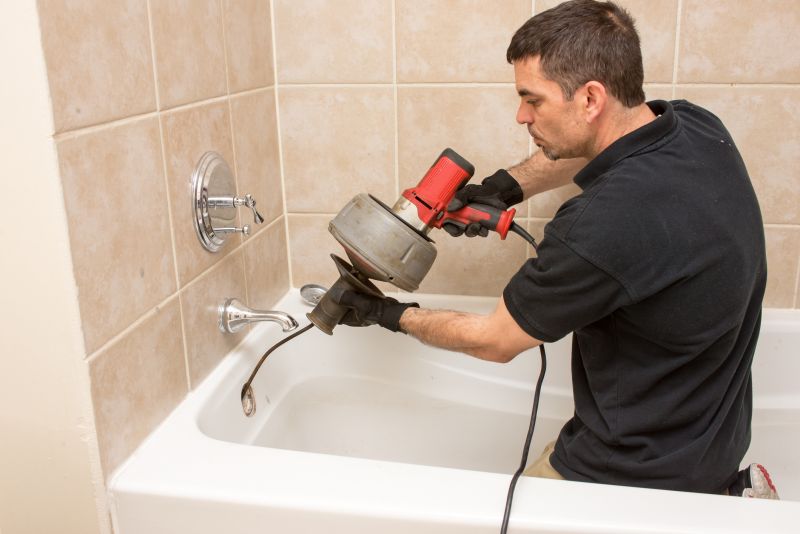 Plumber Installing Bathtub Fixtures
